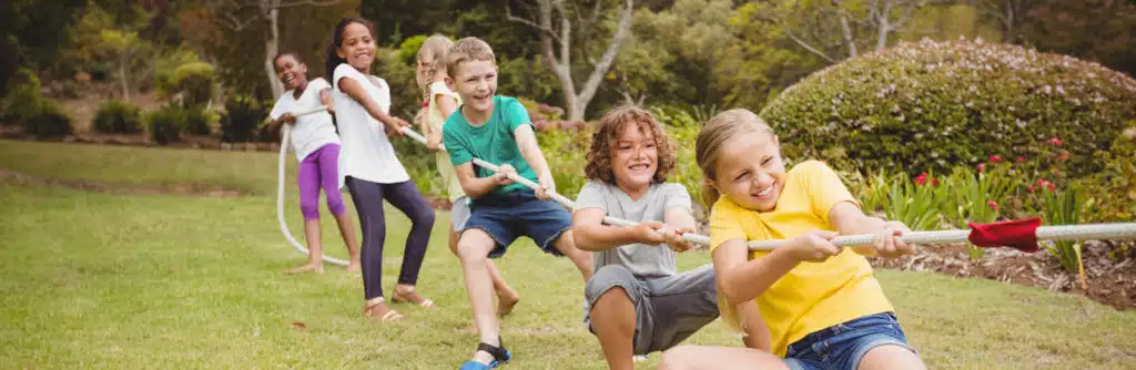 Children have fun and strengthen their muscles while playing tug-of-war.